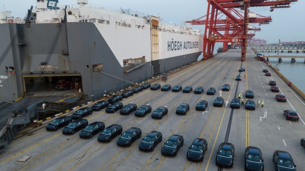 Electric vehicles bound for shipment to Europe at the Port of Taicang in Taicang, China. Bloomberg