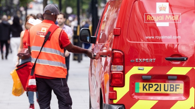 <p>A Royal Mail postman in London.</p>