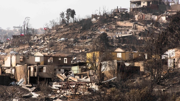 <p>Destroyed homes following wildfires in Vina del Mar, Valparaiso region, Chile, on Feb. 4.</p>