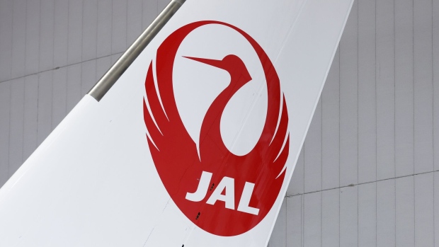 A logo on the tail fin of an Airbus SE A350-1000 aircraft operated by Japan Airlines Co. (JAL) at the company's hangar at Haneda Airport in Tokyo, Japan, on Monday, Jan. 15, 2024. Photographer: Kiyoshi Ota/Bloomberg