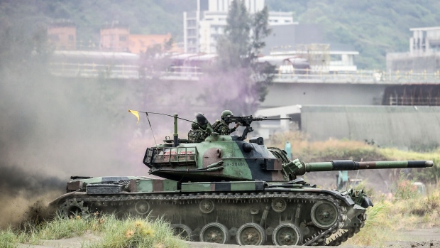 A CM-11 Brave Tiger battle tank participates in an anti-landing drill on Bali beach during the Han Kuang military exercise in New Taipei City, Taiwan, on Thursday, July 27, 2023. China is flexing its military might around Taiwan again as campaigning for the presidency on the democratically run island starts to heat up. Photographer: I-Hwa Cheng/Bloomberg