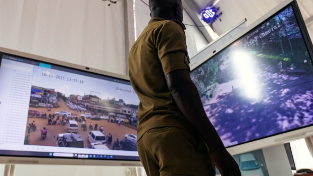 A police officer demonstrates Kampala's smart CCTV system at National Science Week in Kampala in November. Photographer: Badru Katumba/Bloomberg
