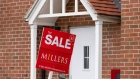 An estate agents "For Sale" sign outside a residential property in Harlow, UK. Photographer: Chris Ratcliffe/Bloomberg