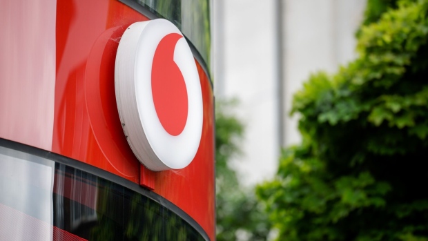 A logo on the exterior of a Vodafone Group Plc store in London, UK, on Monday, May 13, 2024. Vodafone will be reporting their full-year earnings on May 14. Photographer: Jason Alden/Bloomberg