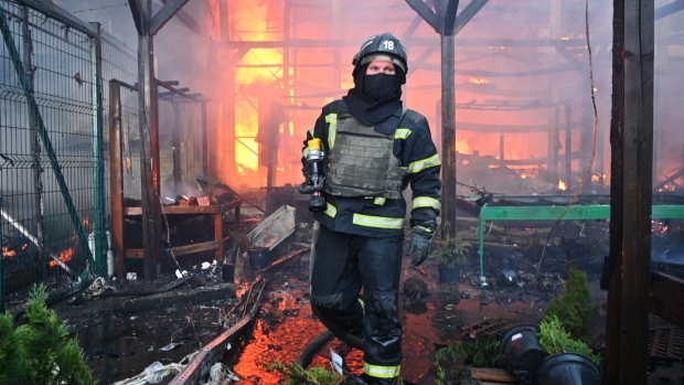 A firefighter tackles a blaze following a Russian strike in Kharkiv in may. Photographer: Sergey Bobok/AFP/Getty Images