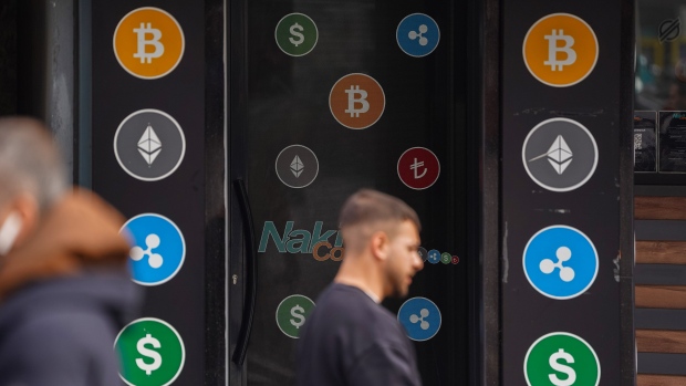 Logos for cryptocurrency coins at the entrance to a cryptocurrency exchange bureau in Istanbul, Turkey, on Friday, March 1, 2024. Bitcoin has jumped over 40% already this year atop the successful debut of the US ETFs, which directly hold the token. Photographer: David Lombeida/Bloomberg