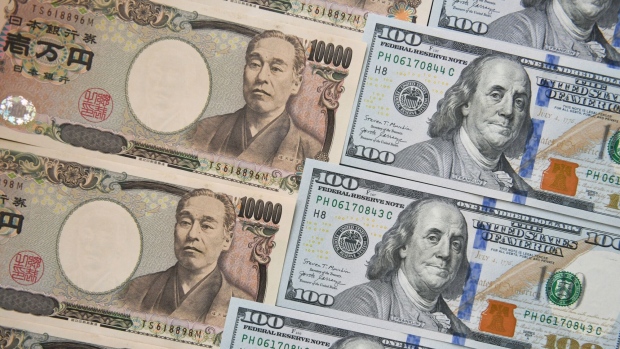Japanese 10,000 yen, left, and US 100 dollar banknotes arranged for a photograph in Tokyo, Japan, on Friday, May 10, 2024. The Bank of Japan offered to purchase a smaller amount of government bonds in a regular operation on May 13 than it did on April 24 as it seeks to reduce its presence in the country’s debt market. Photographer: Noriko Hayashi/Bloomberg