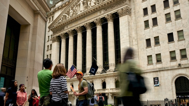 Pedestrians near the New York Stock Exchange (NYSE) in New York, US, on Monday, Aug. 28, 2023. Stocks advanced, while bond yields retreated at the start of a week jam-packed with economic reports that will help shape the outlook for Federal Reserve policy. Photographer: Gabby Jones/Bloomberg