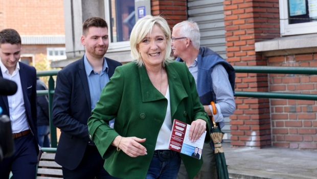 Marine Le Pen meets with local residents during her visit to a local market in Courrieres, northern France on June 21. Photographer: Denis Charlet/AFP/Getty Images