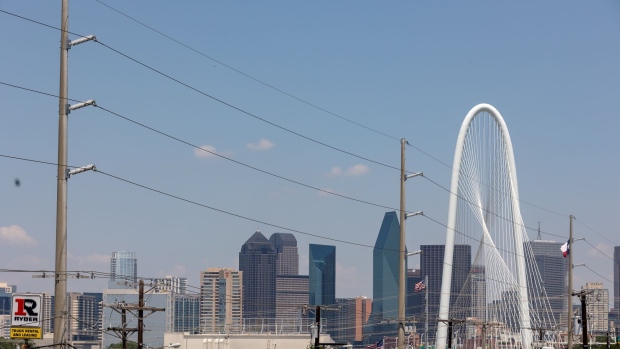 <p>Power lines run in front of Margaret Hunt Hill Bridge in Dallas, Texas.</p>
