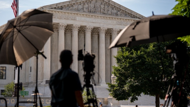 WASHINGTON, DC - JUNE 20: A member of the media sets up near the Supreme Court on June 20, 2024 in Washington, DC. The Supreme Court is about to issue rulings on a variety of high profile cases dealing with abortion rights, gun rights, and former President Donald Trump's immunity claim, putting the court at the center of many hot political topics during an election year. (Photo by Andrew Harnik/Getty Images)