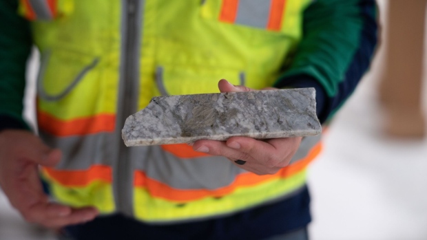 A geologist with a polished core sample showing raw materials that are typically extracted during lithium mining operations at the Albermarle mine in Kings Mountain, North Carolina, US, on Wednesday, Aug. 10, 2022. Albemarle Corp. wants to restart a lithium mine as the building block of the first complete EV battery supply chain in the US. Photographer: Logan Cyrus/Bloomberg