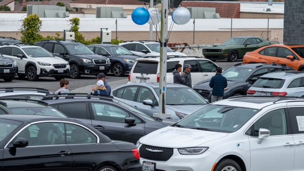 Customers view used vehicles for sale at a dealership in Colma, California, US. Photographer: David Paul Morris/Bloomberg