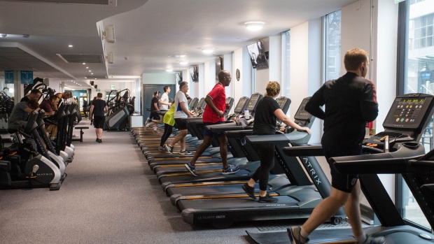 People run on treadmills to exercise. Photographer: Simon Dawson/Bloomberg