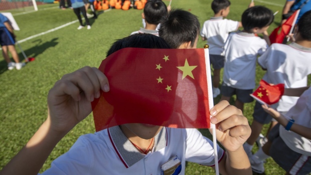 A Students holding a China National Flag. Photographer: Vernon Yuen/NurPhoto/Getty Images