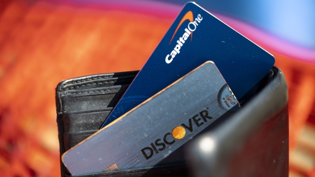 Capital One and Discover credit cards arranged in Rhinebeck, New York, US, on Tuesday, Feb. 20, 2024. Capital One Financial Corp. agreed to buy Discover Financial Services in a $35 billion all-stock deal to create the largest US credit card company by loan volume, giving the combined entity a stronger foothold to compete with Wall Streets behemoths. Photographer: Angus Mordant/Bloomberg