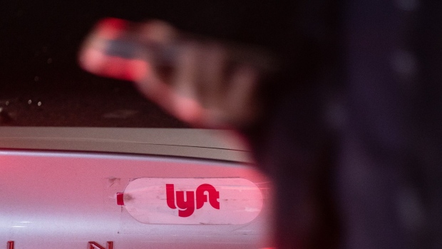Lyft signage on a car at San Francisco International Airport (SFO) in San Francisco, California, US, on Thursday, Feb. 8, 2024. Lyft Inc. is scheduled to release earnings figures on February 13. Photographer: Loren Elliott/Bloomberg