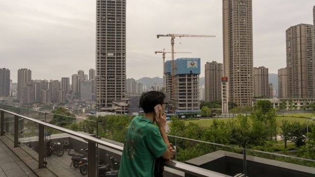 Buildings under construction in Chongqing, China on Thursday, May 2, 2024. China's ruling Communist Party vowed to explore new measures to tackle a protracted housing crisis, which remains the biggest drag on the nation’s economy, and hinted at possible rate cuts ahead. Photographer: Raul Ariano/Bloomberg
