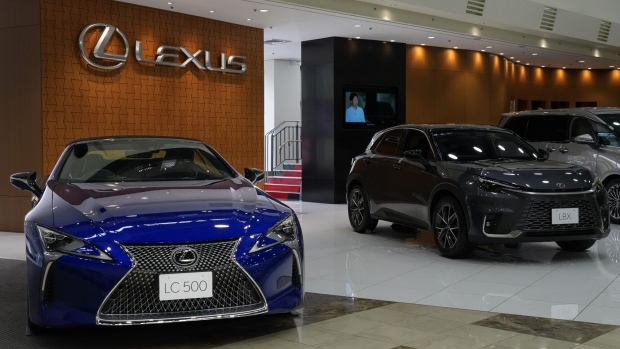 <p>A Toyota Motor Corp. Lexus LC 500 convertible vehicle, left, and Lexus LBX hybrid electric vehicle, on display at a company showroom.</p>