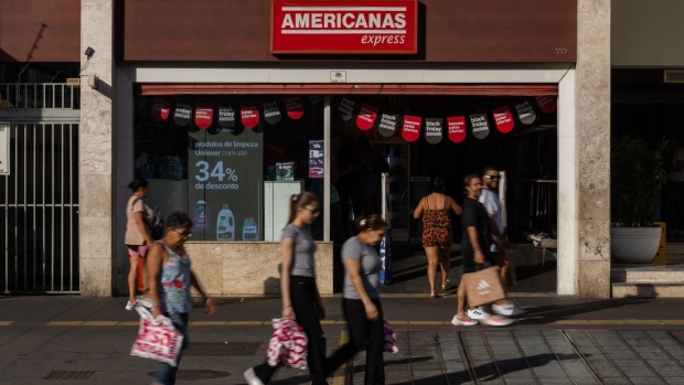Pedestrians walk past an Americanas store in Sao Paulo, Brazil, on Wednesday, Nov. 22, 2023.