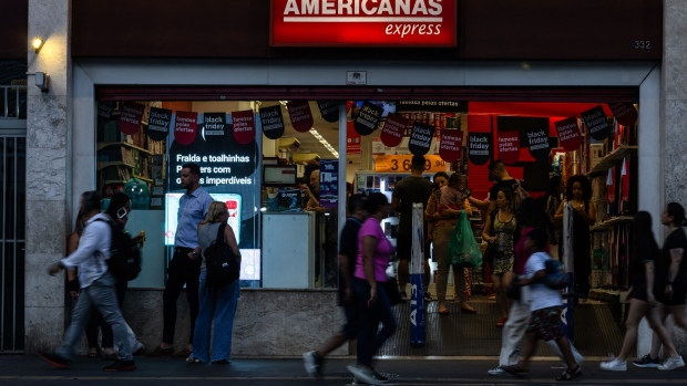 Pedestrians walk past an Americanas store in Sao Paulo, Brazil, on Wednesday, Nov. 22, 2023. Americanas, one of Brazils largest brick-and-mortar retailers, said the size of an accounting scandal that sent the firm into bankruptcy was 25.2 billion reais ($5.2 billion) about 5 billion reais more than it previously estimated. Photographer: Maira Erlich/Bloomberg