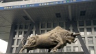 A bull statue in front of the Shenzhen Stock Exchange building in Shenzhen, China on Tuesday, May 7, 2024. As the Chinese bond market undergoes a powerful rally, the nation's so-called policy banks are turning away from the People's Bank of China as a source of funding and rushing to raise debt instead. Photographer: Raul Ariano/Bloomberg