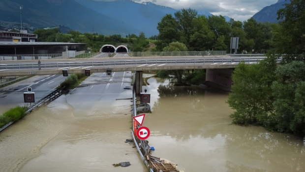 The A9 motorway partially flooded near Sierre, western Switzerland, June 30. Photographer: Boris Herger/AFP/Getty Images