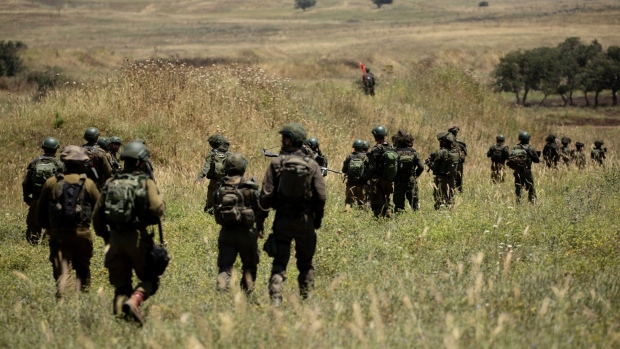 <p>An Israeli military training drill in Golan Heights in May.</p>