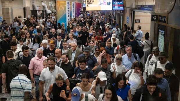 Commuters at the New Jersey Transit train platform at Penn Station on June 18.