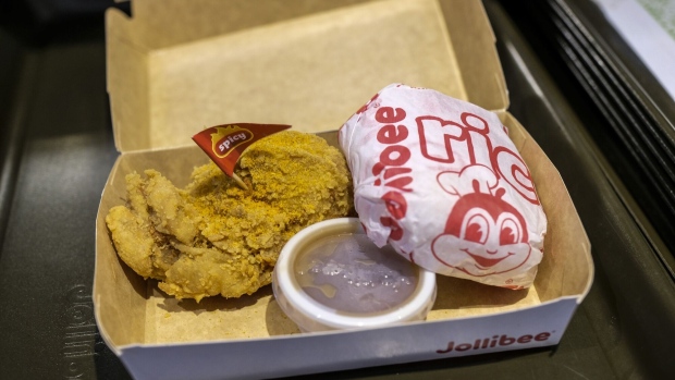 A fried chicken meal at a Jollibee Foods Corp. restaurant in Taguig City, Manila, the Philippines, on Saturday, March 13, 2021. Jollibee will boost capital spending by a fifth to open 450 new stores mostly overseas, as the Philippines' largest restaurant operator foresees a return to profit this year following its first annual loss in nearly three decades. Photographer: Veejay Villafranca/Bloomberg