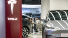 Customers inside a Tesla Inc. showroom in Shanghai, China, on Monday, April 29, 2024. Elon Musk's surprise visit to China appears to have paid immediate dividends, with Tesla clearing two key hurdles to introduce its driver-assistance system to the world's biggest auto market. Photographer: Qilai Shen/Bloomberg