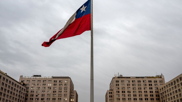 A Chilean national flag flies at Plaza de la Ciudadania in Santiago, Chile, on Monday, May 20, 2024. Chile's economy recorded the fastest quarterly growth since 2021, when government stimulus fueled domestic demand during the pandemic, as both mining output and consumption increased while slowing inflation and falling interest rates provided much-needed relief.