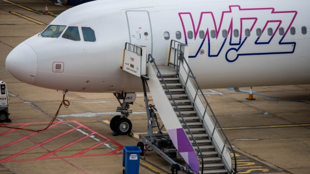 <p>A Wizz Air passenger aircraft on the tarmac at London Luton Airport in Luton, UK.</p>