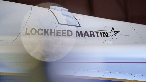 A sign for Lockheed Martin on the X-59 aircraft during a media preview at Lockheed Martin Skunk Works in Palmdale, California, US, on Friday, Jan. 12, 2024. Lockheed Martin Corp. and NASA unveiled the X-59, a supersonic jet designed to fly faster than the speed of sound (about 760 mph at sea level) with much less noise. Photographer: Eric Thayer/Bloomberg