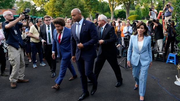 Wes Moore, governor of Maryland, from left, Tim Walz, governor of Minnesota, and Kathy Hochul, governor of New York, depart after speaking to members of the media outside the White House in Washington, DC, US, on Wednesday, July 3, 2024. Several leading Democratic governors said they were firmly behind President Joe Biden after a meeting at the White House following last week’s disastrous debate performance. Photographer: Yuri Gripas/Bloomberg