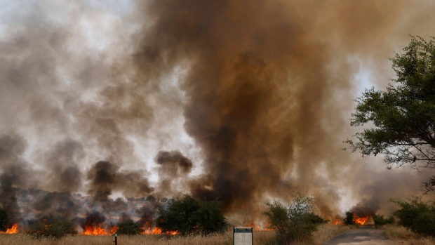 Fires burn after rockets were fired from southern Lebanon, in northern Israel on July 4. Photographer: Jalaa Marley/AFP/Getty Images